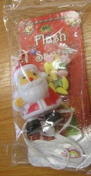 Giocattolo di plastica con dolci «Flash Santa» (Sweet's Fun)