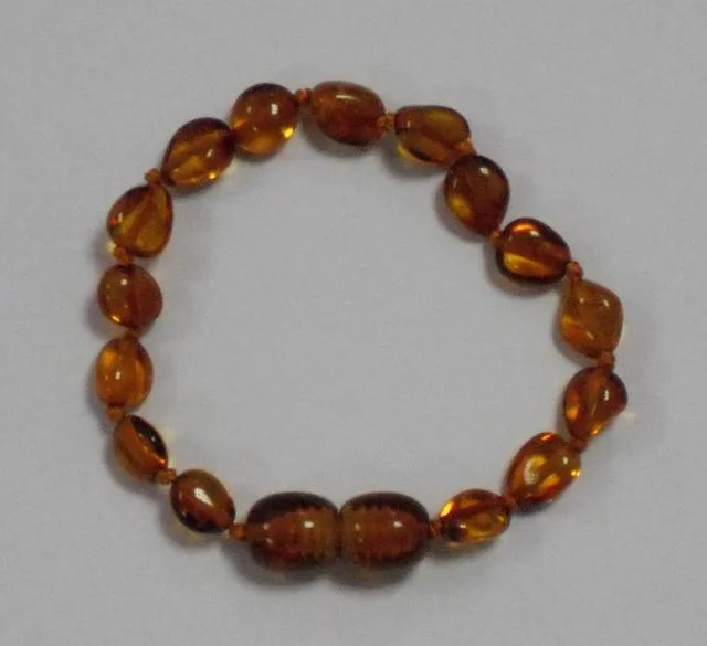 Collana di dentizione ambra e bracciale «Honey Bean» — foto 2 dell'alert A12/0354/13