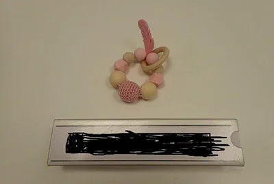 Giocattolo con dentiera in legno «Shooter Cord» (Softie Baby Musthaves)