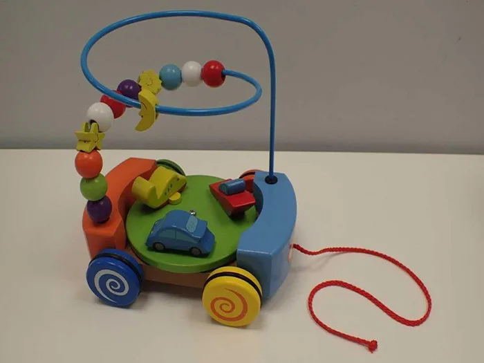 Giocattolo di legno «Vehicles Carrousel» (Primi Passi)
